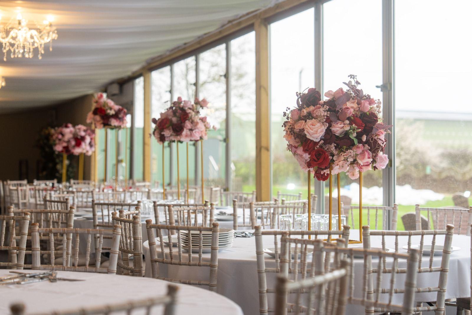 Hanging floral centerpieces by the garden window
